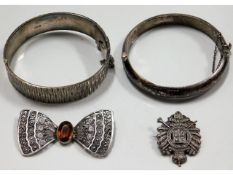 A well constructed 0.835 silver & citrine filigree bow brooch, two silver bangles & one white metal