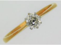 An antique 18ct gold diamond ring set with old cut