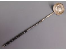 A 19thC. baleen & white metal toddy, tests as silver, 12.75in long, initialled "I.S", 31.3g