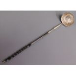 A 19thC. baleen & white metal toddy, tests as silver, 12.75in long, initialled "I.S", 31.3g