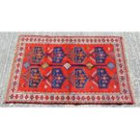 A Persian rug, 73in long x 46in wide