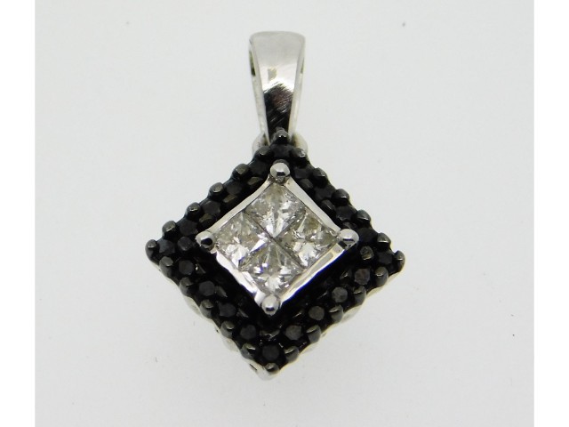 A 10ct white gold pendant set with black & white d