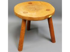 A modern oak milking stool, 11.75in high