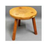 A modern oak milking stool, 11.75in high