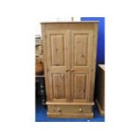 A pine wardrobe, 68in high x 32in wide x 22.75in d