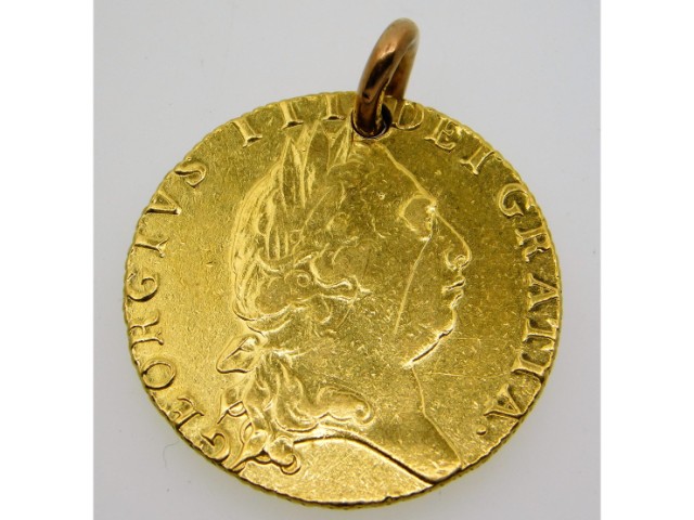 A 1793 George III 22ct gold guinea with pierced mo