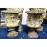 A pair of ornate reconstituted stone campana plant