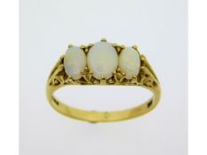 A 9ct gold ring set with opal within a decorative