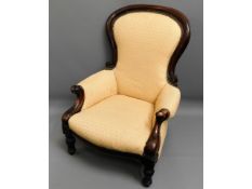 A Victorian upholstered walnut arm chair, 41in hig