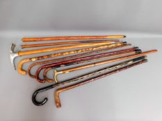 A quantity of ten walking sticks & aids including