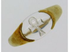 A 9ct gold ring, signed within band Uri Geller, set with intaglio Symbol of Life etched into rock cr