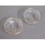A pair of antique cut glass bonbons set with silve
