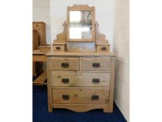 An Edwardian pine dressing table chest 61.5in high