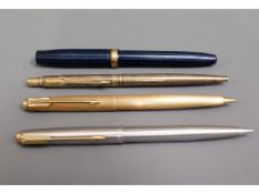 A Conway Stewart fountain pen, two Parker biros &