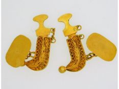 A pair of 21ct gold middle eastern Jambiya dagger