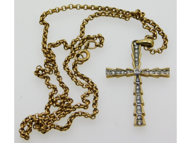 A 9ct gold necklace with cross set with 0.25ct dia