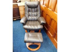 A Stressless style leather armchair & stool