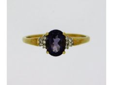 A 9ct gold ring set with amethyst & ten small diam