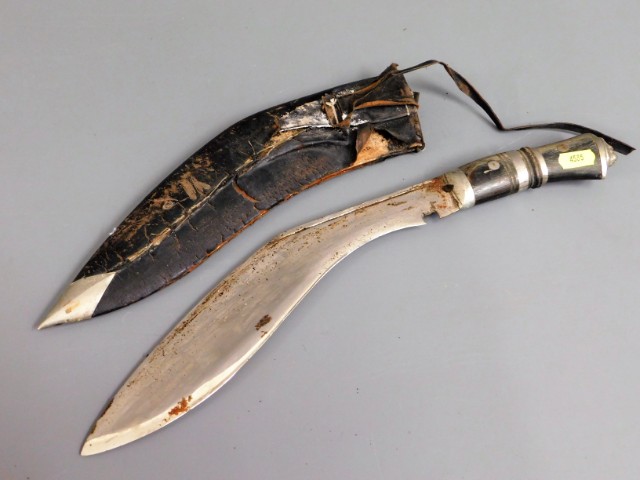 A kukri knife with leather scabbard & horn handle