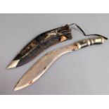 A kukri knife with leather scabbard & horn handle