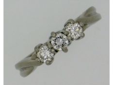 A platinum, three stone trilogy ring with 0.33ct o