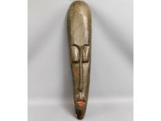 A carved ethnic mask, 39in high