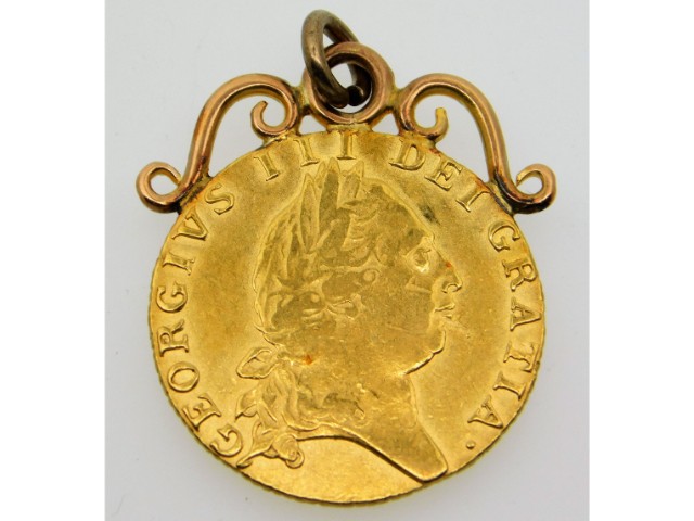 A 1790 mounted George III 22ct gold guinea, 9.6g