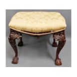 A Victorian style upholstered stool with ball & cl