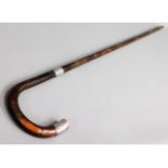 A silver tipped & collared gents walking cane, 35i