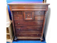 A reproduction hardwood Scottish style chest of dr