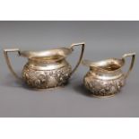 A 1903 Birmingham silver sugar bowl & creamer with