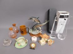 A Dartington glass vase, a Capodimonte dolphin gro