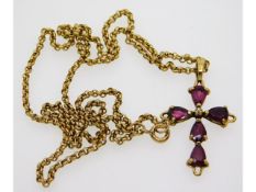 A 9ct gold necklace with cross set with ruby & dia