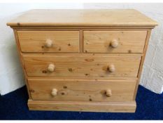 A low level pine chest with four drawers, 33.75in