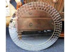 A circular mirror with mosaic style outer edge, 25