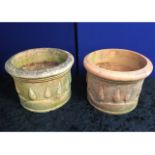 Two decorative terracotta garden pots with tree de
