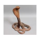 An early 20thC. two piece carved rosewood cobra, 1