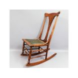 A child's mahogany rocking chair, 34.5in high to t