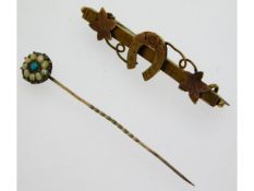 A yellow metal tiepin set with pearl & turquoise t