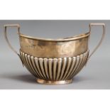 A Birmingham 1910 silver sugar bowl with gadrooned