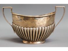 A Birmingham 1910 silver sugar bowl with gadrooned