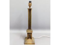 A brass columned lamp base, 21.75in tall