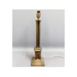 A brass columned lamp base, 21.75in tall