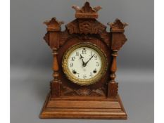 A gothic style Ansonia wooden mantel clock, 15in t