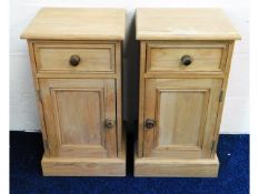 A matching pair of pine bedside cabinets, 26.5in h