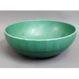 An art deco Wedgwood Keith Murray bowl in green, three small chips, 9.5in diameter