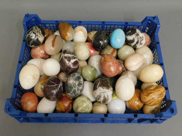 A collection of polished stone eggs, in excess of