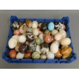 A collection of polished stone eggs, in excess of