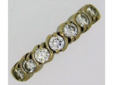 An 18ct yellow gold half eternity ring set with ap