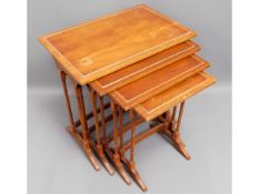 A nest of four tables, largest 23in wide x 15.5in